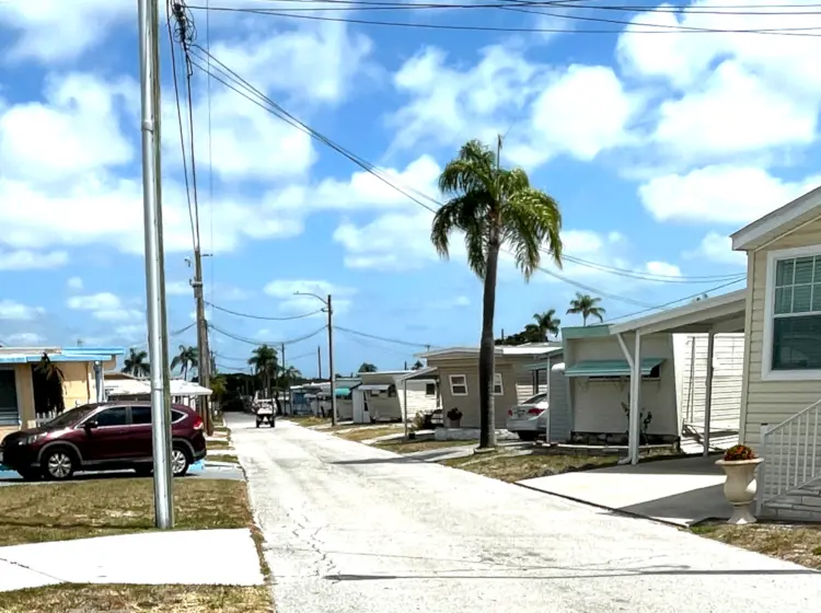 View of the peaceful street near the trailer in a quiet over-55 community.